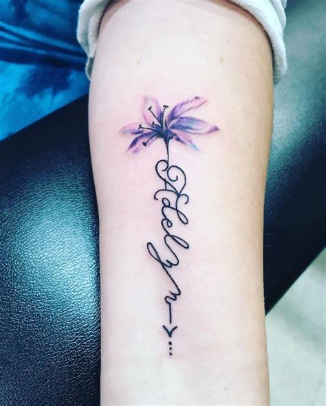 flowers with writing tattoo|More.